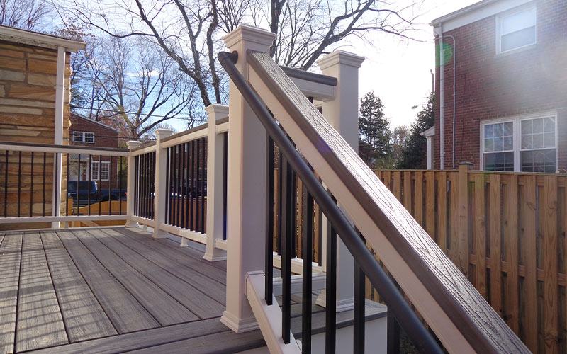 railing of a composite deck in enclosed backyard