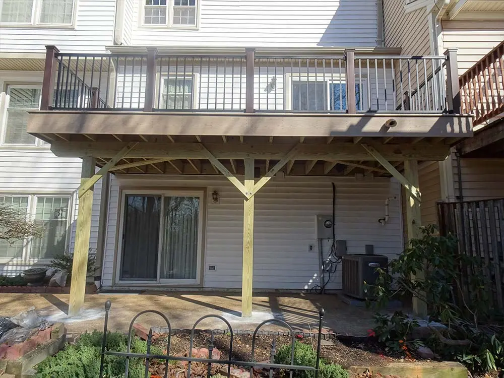 Second floor Composite & PVC Deck covering paved patio entrance