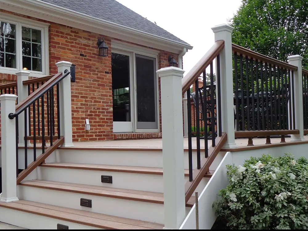 Composite & PVC Deck behind a brick home