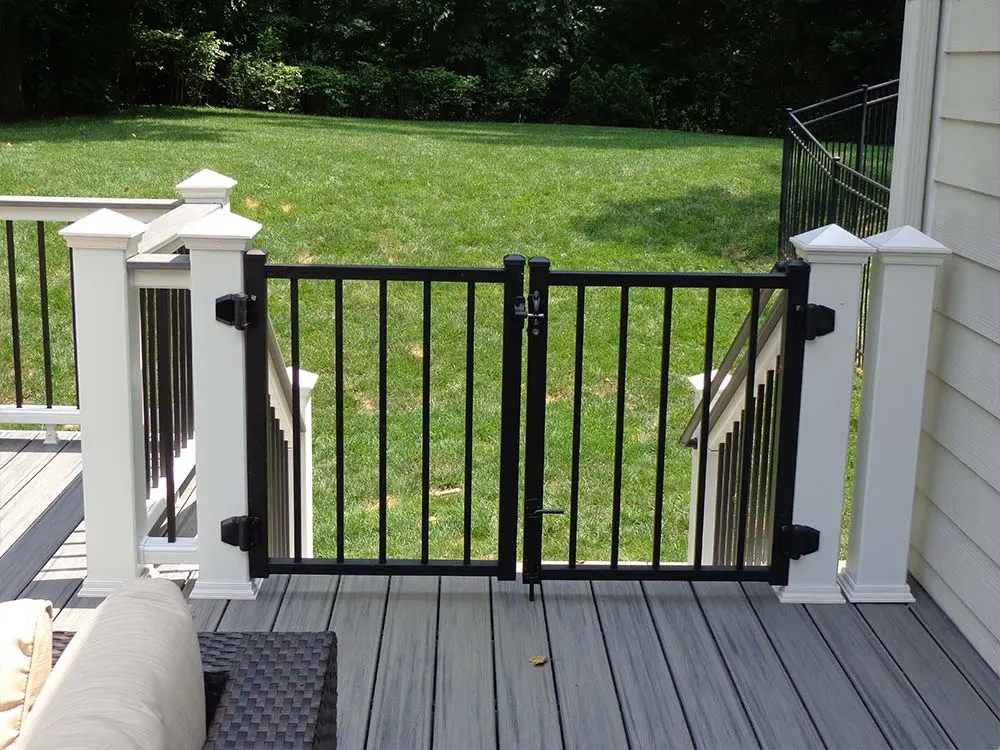 Composite & PVC Deck with small metal stairway gate