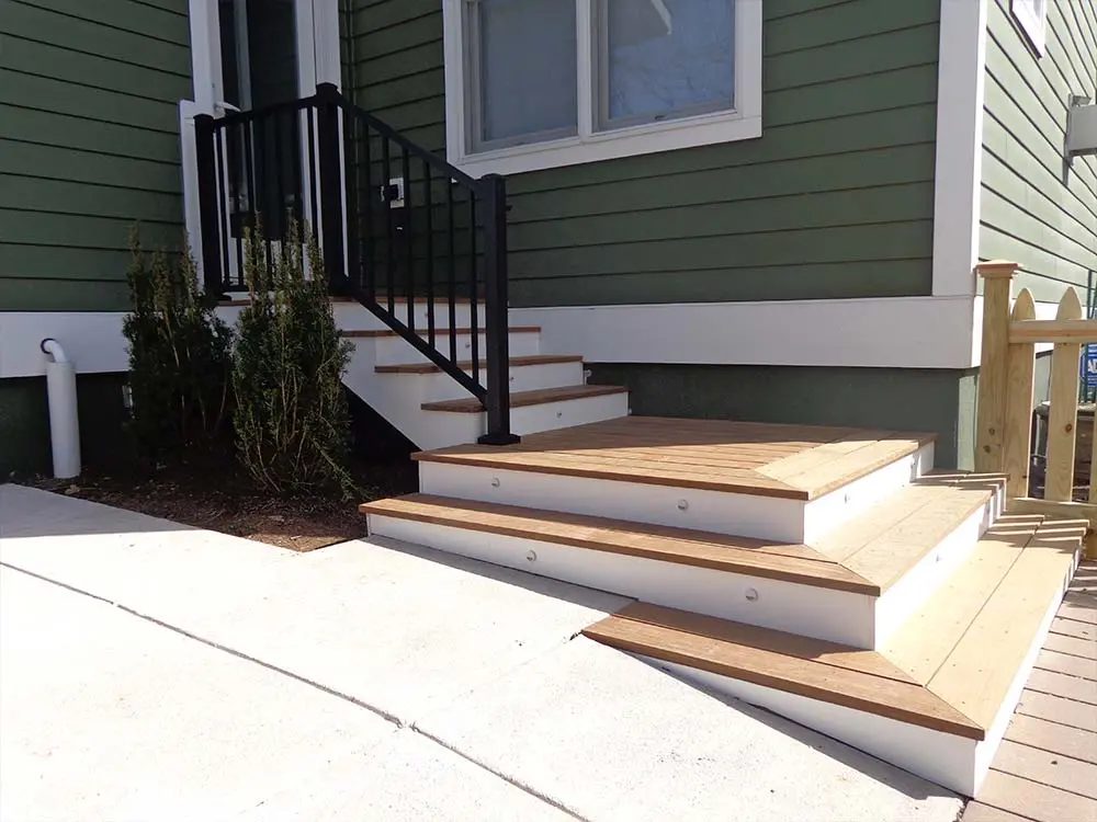 Composite & PVC Deck in front of green house