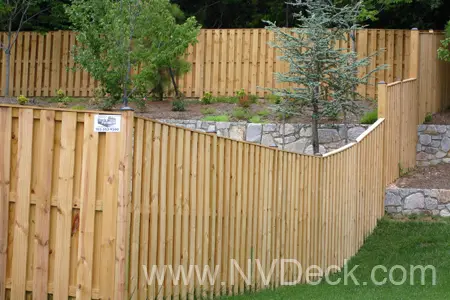 Pressure Treated Pine Fence along sloped yard