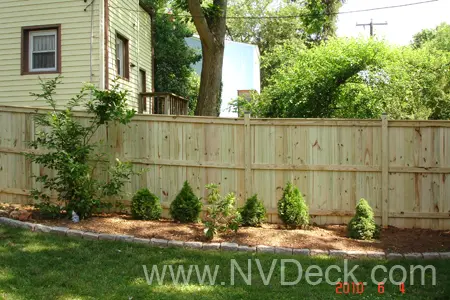 Pine Fence with Shrubbery