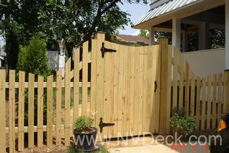 Custom Pine Fence and Gate with planks in a wave design