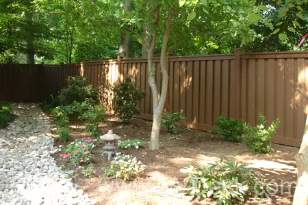 Trex Fenced Garden with White Stone Walking Path